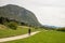 Hiker mother with baby near scScenic Bohinj lake with its green surroundings in Slovenia