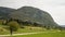 Hiker mother with baby near scScenic Bohinj lake with its green surroundings in Slovenia