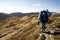 Hiker in the mountains with backpacks