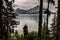 A hiker in the mountains and lakes of Peter Lougheed Provincial Park. Kananaskis Lakes, Alberta. Canada