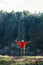 Hiker outstretched hands while observing cliff view