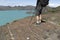 Hiker overlooking Sapphire Lake in Torres del Paine, Chile