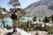 Hiker overlooking scenic mountain lake