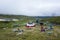 Hiker packing tent, Hiking in Swedish Lapland on Kungsleden trail in northern Sweden. Arctic mountain nature of Scandinavia