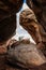 Hiker Passes Around Large Boulder In Rock Pile Cave