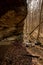 HIker Passes Under Small Waterfall In Remote Mammoth Cave