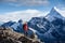 Hiker posing at camera on the trek in Himalayas, Nepal