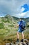 Hiker at Prevalski lake in national park Pirin