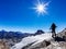 Hiker reaches a high mountain pass, Italian Alps, Val D`Aosta, I