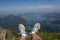 Hiker resting on a mountain top overlooking Wolfgangsee Lake in Strobl, Austria