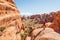 Hiker rests in Arches National park in Utah, USA