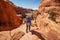 Hiker rests in Arches National park in Utah, USA