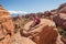 Hiker rests in Arches National park in Utah, USA