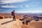 Hiker rests in Canyonlands National park in Utah, USA