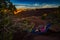 Hiker rests on a hammock admiring the sunset East Fork Shafer Ca