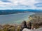 Hiker rests Little Atlin Lake scenery Yukon Canada