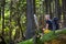 Hiker rests on a trail in a wood