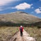 Hiker on the road to the mountain Rtanj in Serbia