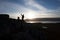 Hiker on a rocky cliff during the sunset. Great atmosphere with