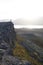 Hiker on a rocky cliff during the sunset. Great atmosphere with