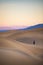 The Hiker at Sand Dune during Sunset at Death Valley National Pa