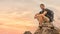 Hiker sitting on rock for resting during walking on trekking trail