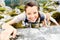 Hiker smiles while climbing up a rocky wall