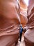Hiker in Spooky Gulch slot canyon, at Dry Fork, a branch of Coyote Gulch, Grand Staircase Escalante National Monument