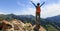 Hiker stand at cliff edge on mountain top