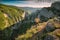 Hiker standing on a cliffs edge over a Big Crimea Canyon