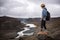 Hiker standing at the edge of a Valley in Vatnajokull National Park in Iceland