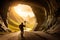 A hiker standing at the entrance of an ancient cave, holding a torch, mysterious underground chambers