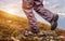 Hiker standing on top of a mountain and enjoying sunrise