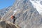 Hiker stands on the mountainside in Himalayas