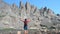 Hiker stands on Rocks at Sky Pond