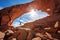 Hiker stay below Skyline arch in Arches National Park in Utah, USA