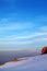 Hiker in sunrise snow mountains