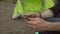 Hiker with tablet in the forest near tent close-up