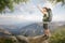 Hiker taking a selfie in front of a tropical mountain panorama