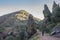 Hiker at the Three quarzite towers site at National Park of Cabaneros, Spain