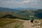 Hiker on the top in Carpathians mountains. Travel sport lifestyle concept