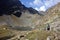 Hiker on the trail heading to the glacial lake