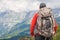 Hiker traveling in Alps. Alpine peaks landskape background. Jungfrau, Bernese highland. Sport, tourism and hiking