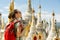 Hiker traveling with backpack and looks at Buddhist stupas. Bir