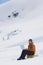 Hiker Using Laptop On Snowy Mountain Landscape