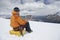 Hiker Using Laptop On Snowy Mountain Landscape