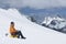 Hiker Using Laptop On Snowy Mountain Slope