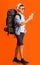 Hiker using trekking app on mobile phone over orange background