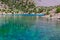 Hiker Walking on Footpath beside Shore Azure Mountain Lake