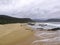 Hiker walking on Nature`s Valley Beach on Garden Route, South Africa